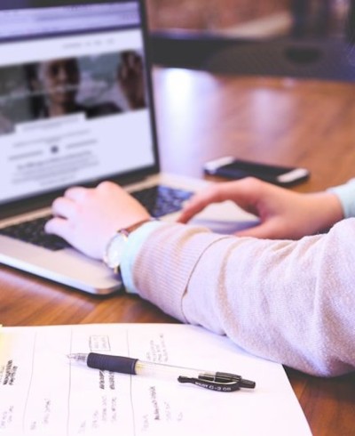 Person typing on laptop
